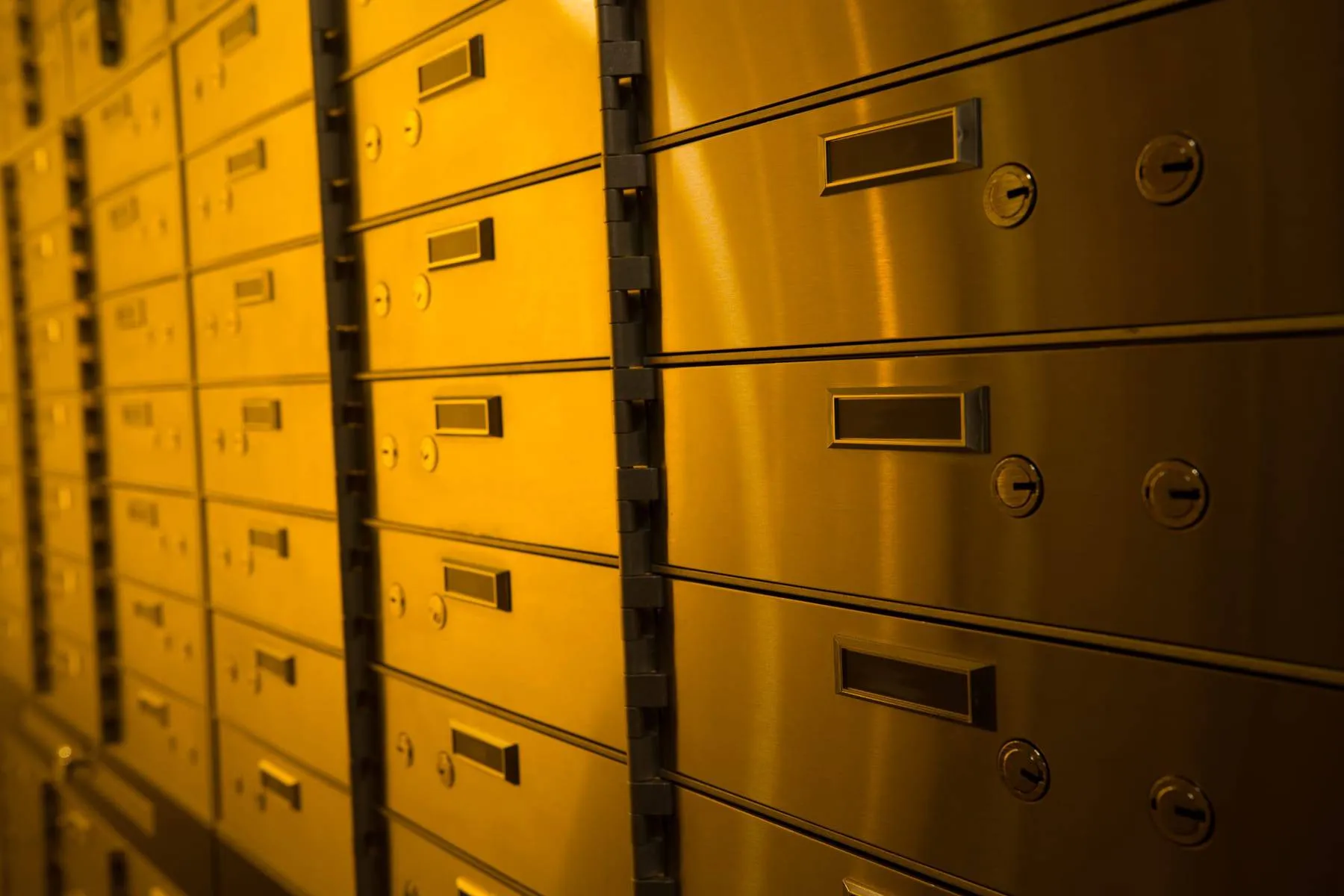 Gold-lit safety deposit boxes at Fortis Vaults Melbourne