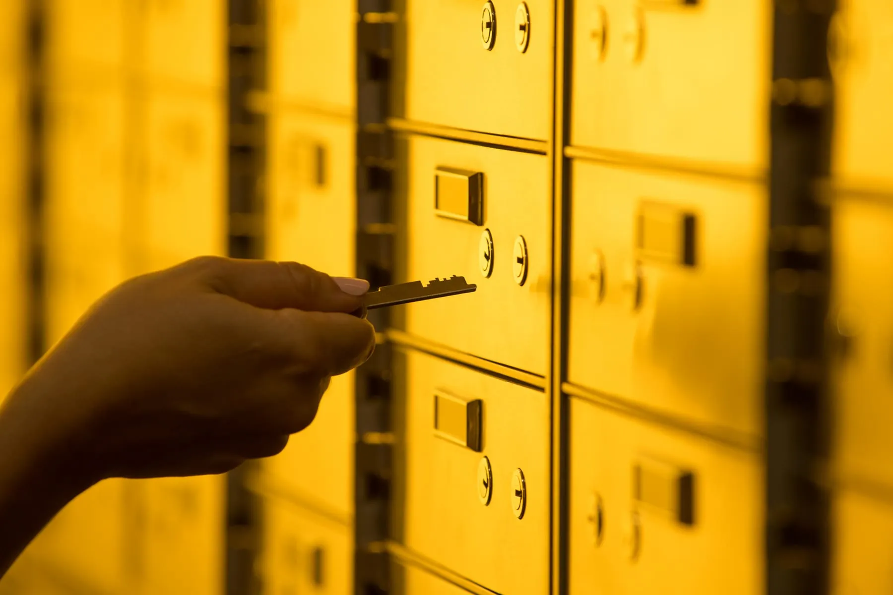 Client securing jewellery in a private safety deposit box at Fortis Vaults